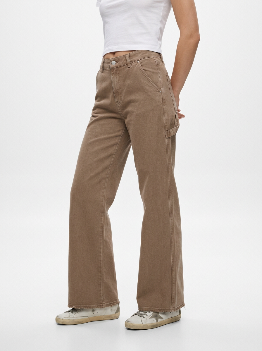 Person wearing brown pants on a white background